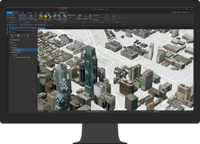 A computer monitor displays a computer-generated 3D city map
