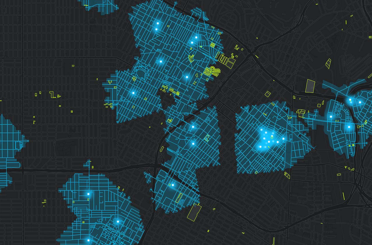 A heat map of a street grid with blue points on a black background