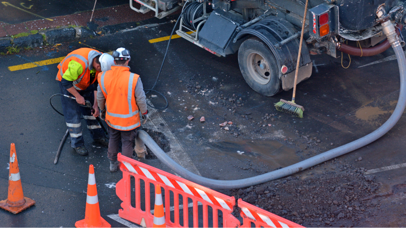 Construction workers working on a road
