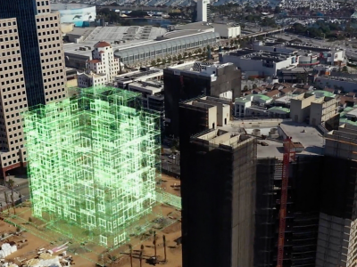 Aerial image of a city with many towering skyscrapers, overlaid with a virtual model of a prospective construction project